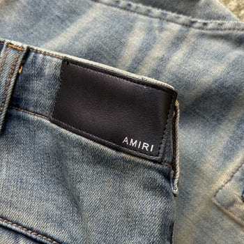 AMIRI MX1 MUD DENIM CARGO LEATHER PATCH DISTRESSED JEANS