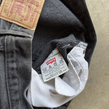 1990s LEVI’S 501 BLACK FADED DENIM JEANS MADE IN USA