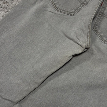 Vaqueros cónicos Levi's 560 de color gris descolorido de los años 90
